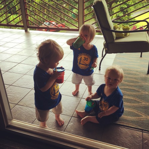 Triplets enjoying drinks on the spacious lanai at our rental. 